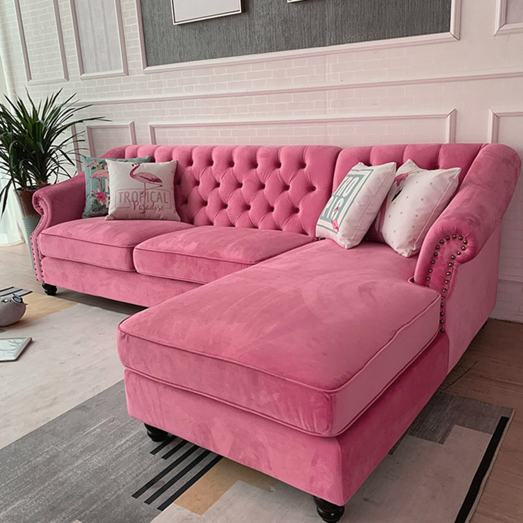 Real Photo Of A Pink Couch With Pillows Standing Next To Big