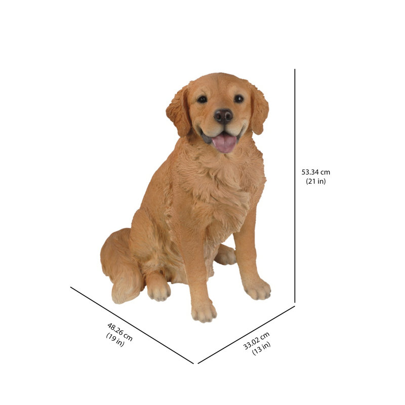 Statue golden retriever assis