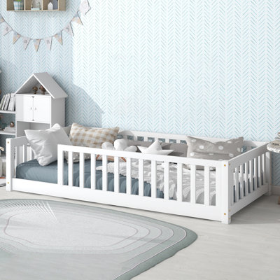Twin Solid Wood Floor Bed With Fence Guardrails by Harriet Bee