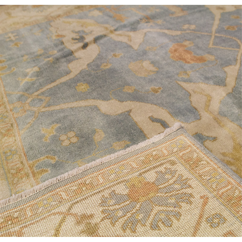Tapis bleu et ivoire de haute qualité noué à la main