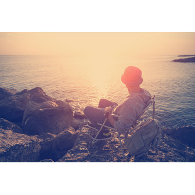 Traveler Sitting Near The Sea