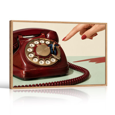 Tableau sur toile représentant un homme d'affaires miniature sur un téléphone à cadran rouge