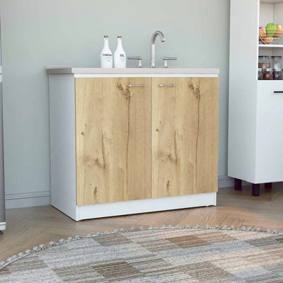 Évier utilitaire avec armoire, une étagère, armoire à deux portes