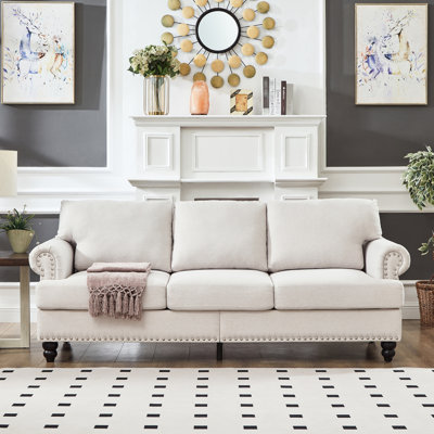 83 po avec housse de coussin amovible, beige, trois sièges, clous à accoudoirs ronds, structure et pieds en bois massif, siège à ressorts ensachés, rangement, rembourré, accoudoir, décoration clous argentés, structure, ressorts