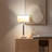 Carter 26 in. Mid-Century Modern Linen and Woodgrain LED Table Lamp