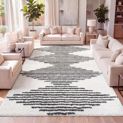 Tapis blanc / gris à poils longs à rayures géométriques Collenn
