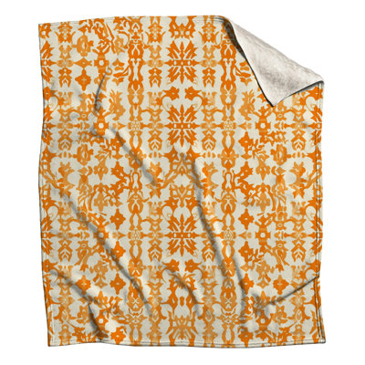 Couvertures orange à motif damassé