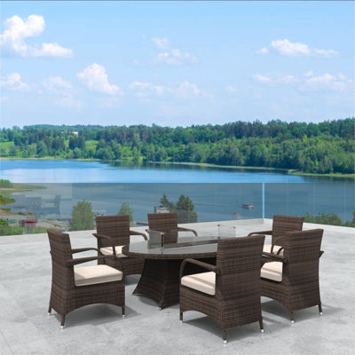 Arnould 6 - Person Wicker Patio Dining Set with Oval Table , Cushions Included