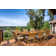 Coster 8 - Person Teak Wood Patio Dining Set with Round Table