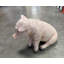 Statue de cochon assis