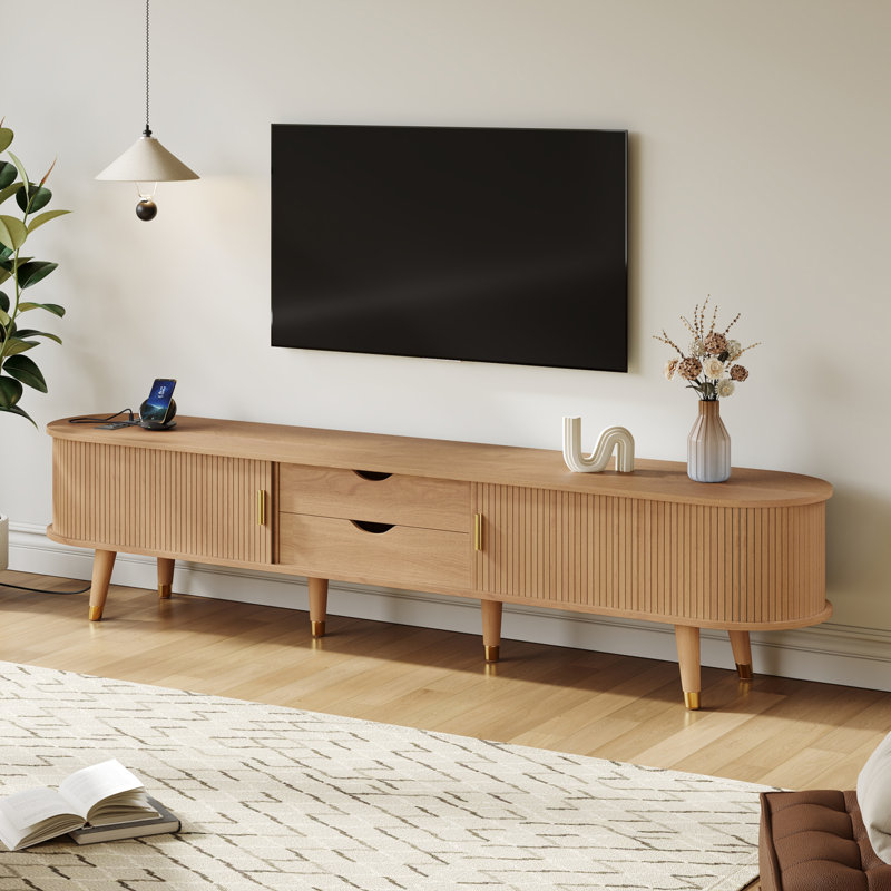 Console média ovale cannelée avec portes à tambour coulissantes et station de charge intégrée avec beaucoup de rangement