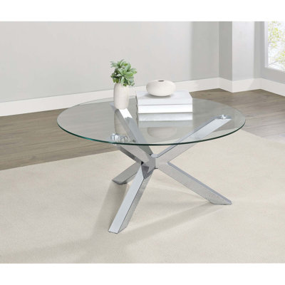 Table basse élégante et moderne avec pieds chromés et plateau en verre trempé
