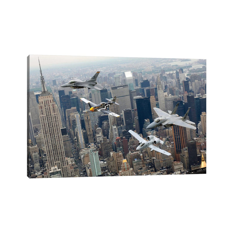 A P-51 Mustang, F-16 Fighting Falcon, F-15 Eagle, And A-10 Thunderbolt II Fly Over New York City by Stocktrek Images - Wrapped Canvas Print