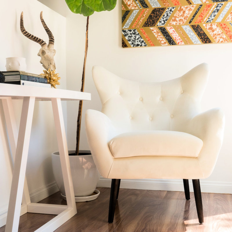 Élégant fauteuil à oreilles rembourré en velours tendance avec support