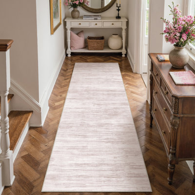 Tapis texturé abstrait rose clair Luminae