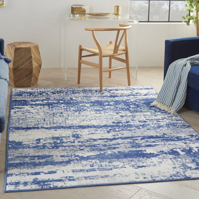 Tapis abstrait bleu / ivoire en polypropylène tissé à la machine, Rectangle 5 pi x 7 pi
