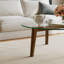 Table basse avec plateau en verre et structure en bois massif