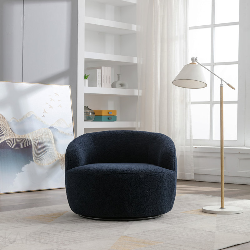 Fauteuil demi-tonneau avec accoudoirs pivotants en tissu Teddy et anneau en métal thermolaqué noir, bleu foncé