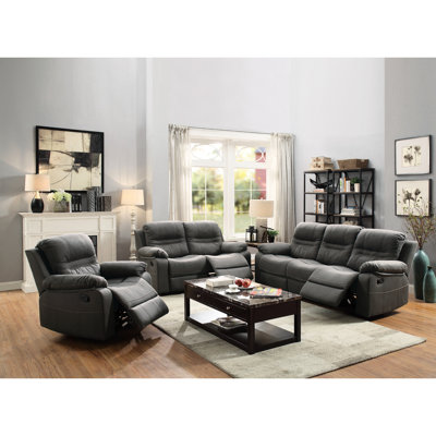 Ensemble de salon moderne 3 pièces comprenant un canapé et un fauteuil inclinable avec accoudoirs rembourrés, recouverts de tissu bleu ardoise. Mobilier contemporain.
