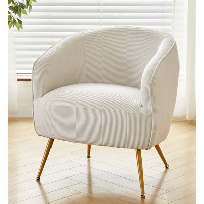 Fauteuil en velours côtelé avec pieds dorés