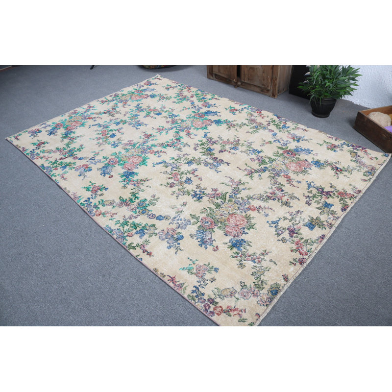 Superbe tapis turc rétro en laine avec des motifs floraux traditionnels dans des tons de terre riches