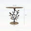 Élégante table d'appoint en aluminium noir et or avec un motif de grenade complexe, parfaite pour un décor moderne et artistique.