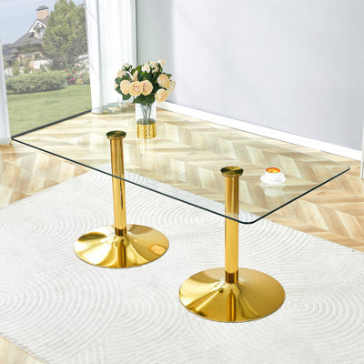 Un plateau de table en verre de 71 x 35,4 pouces et une table de salle à manger circulaire minimaliste moderne avec des pieds en métal doré électrolytique. Convient aux restaurants et aux salons.