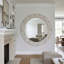 Miroir mural rond en bois avec cadre festonné-130142790