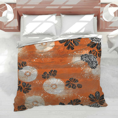 Édredon orange, floral noir