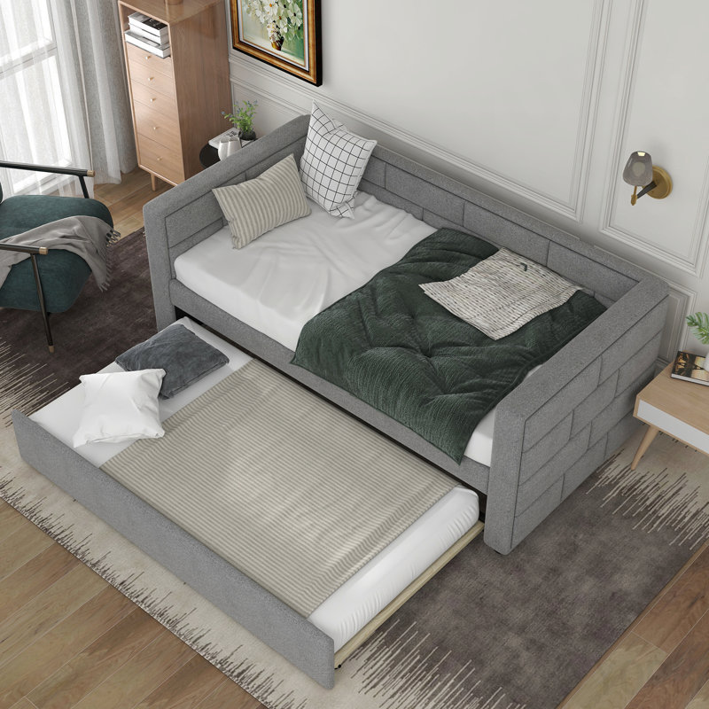 Lit de jour simple avec couchette, base de coussin rembourrée grise, fabrication solide avec dossier rembourré stable