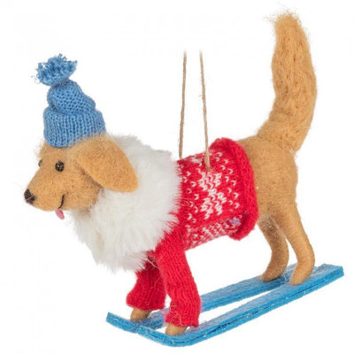 Ornement de chien d'hiver sur des skis