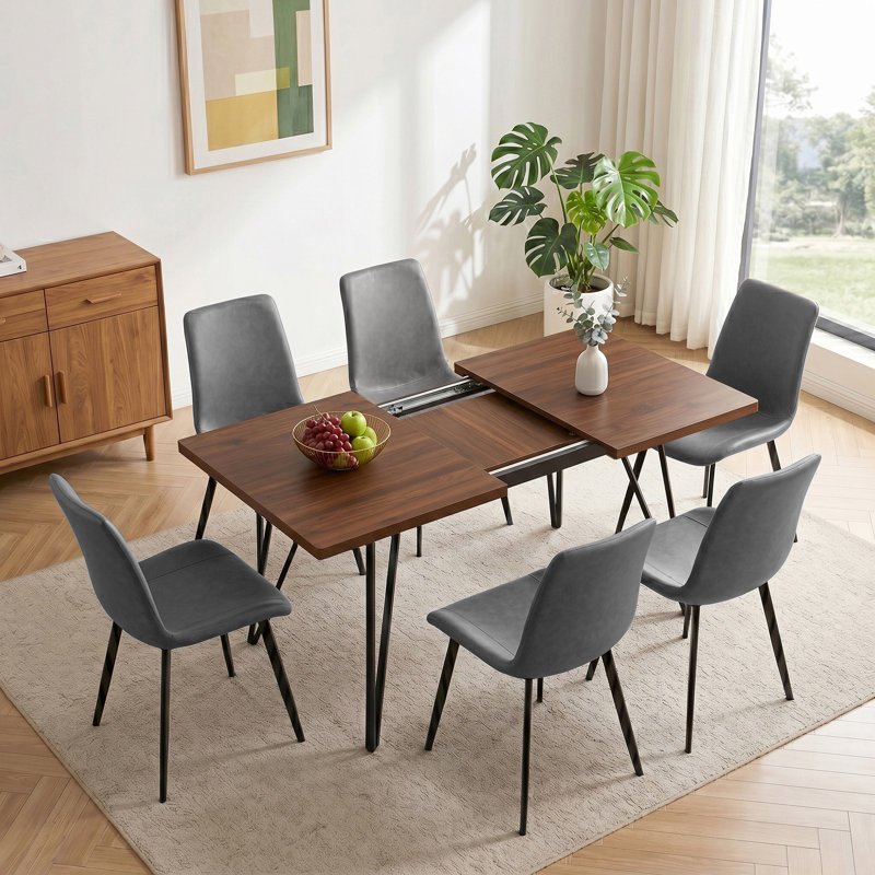 Ensemble de salle à manger 7 pièces à rallonge, table en MDF effet noyer avec pieds en métal noir et 6 chaises en polyuréthane gris, pouvant accueillir 6 personnes