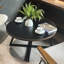 Table basse ronde grain de bois et métal noir