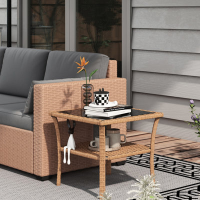 Table basse de patio avec rangement et plateau décoratif en verre trempé, piètement en aluminium.