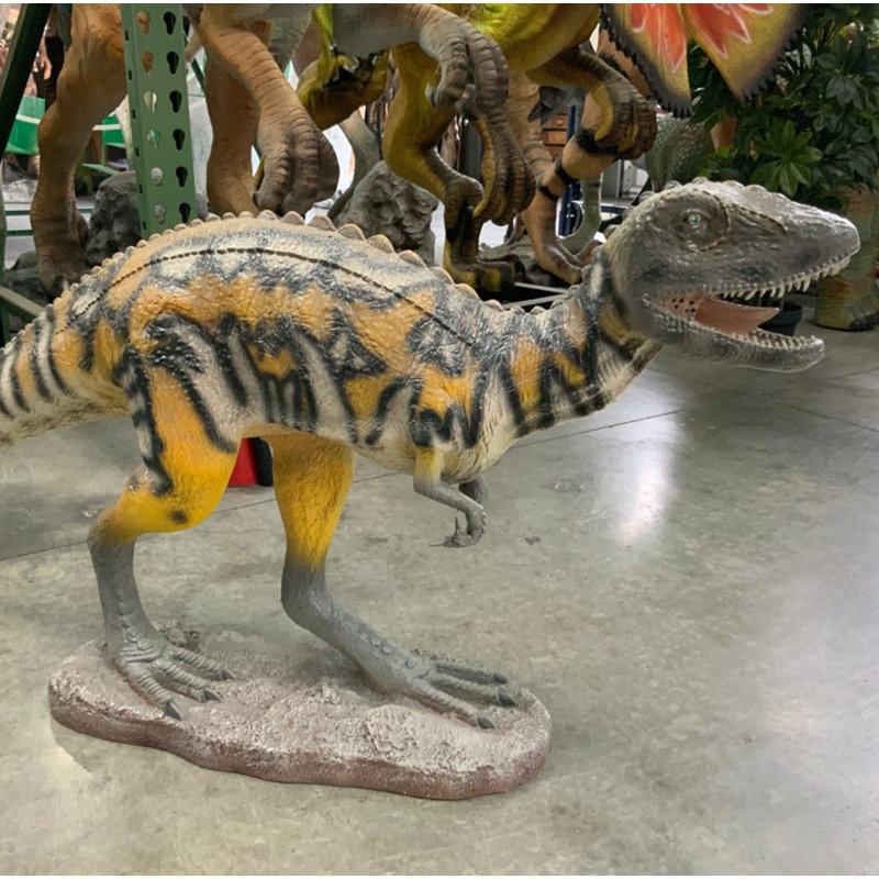 Petite statue de dinosaure australovénateur grandeur nature