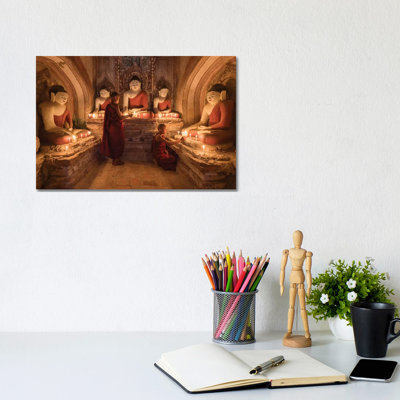 Two Young Novice Monks Praying To Buddha, Bagan, Myanmar by Jan Becke - Wrapped Canvas Print