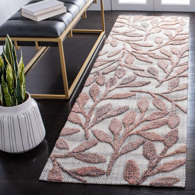 Tapis floral rouille touffeté à la main