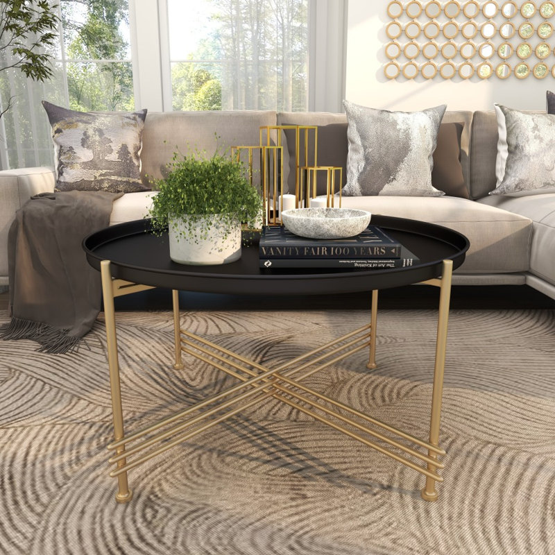 Table basse à plateau en métal noir avec base en X dorée