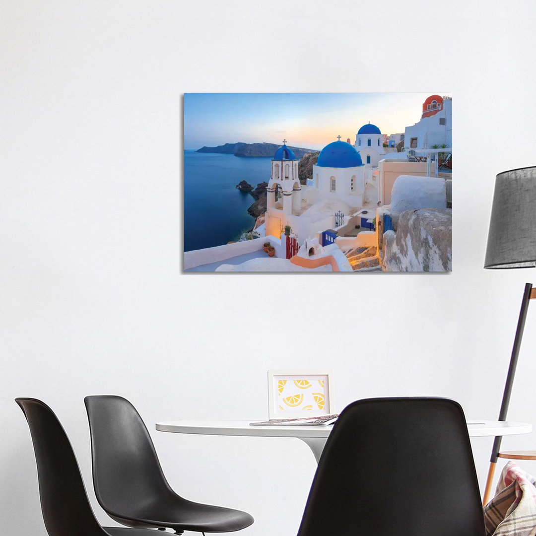 Greece, Santorini, Oia. Sunset On Coastal Town. by Jaynes Gallery - Wrapped Canvas Print