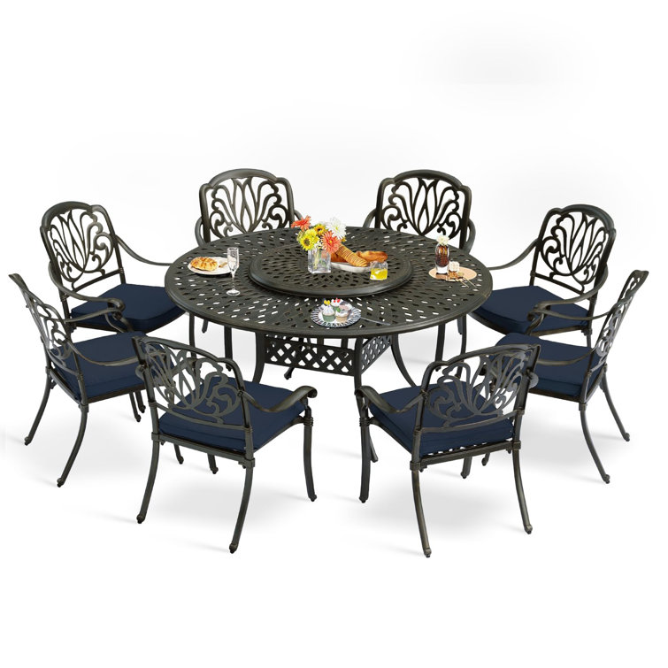 9-Piece Dining Set includes 1 round table with detachable lazy susan, 8 cushioned chairs