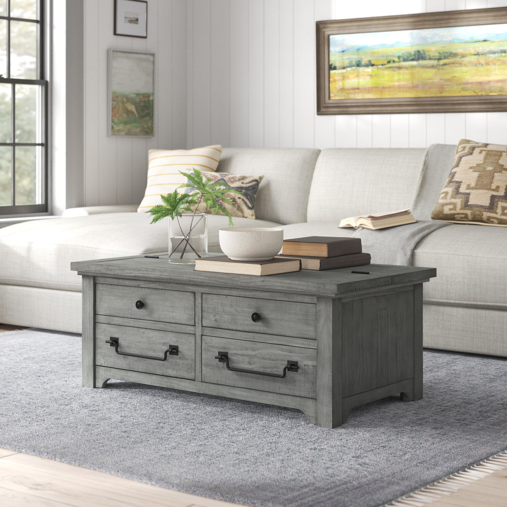 Rosalind Wheeler Breta Solid Wood Wheel Coffee Table with Storage