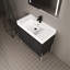 Meuble-lavabo moderne avec lavabo en résine et chêne foncé