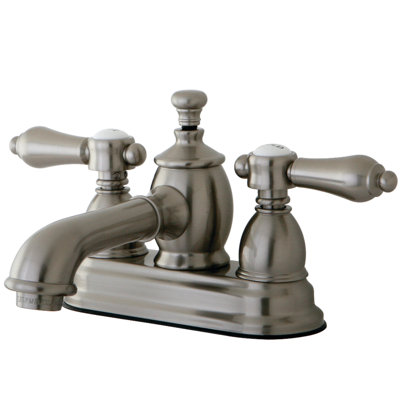 Kingston Brass Heirloom Two-Handle 3-Hole Deck Mount 4" Centerset Bathroom Faucet with Brass Pop-Up