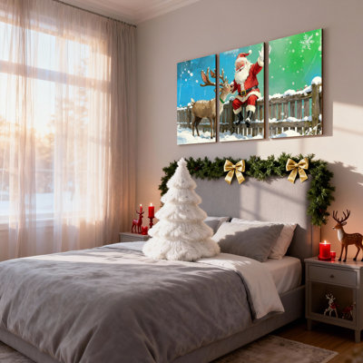 Noël, père Noël et renne dans une scène enneigée, ensemble de 3 impressions sur toile