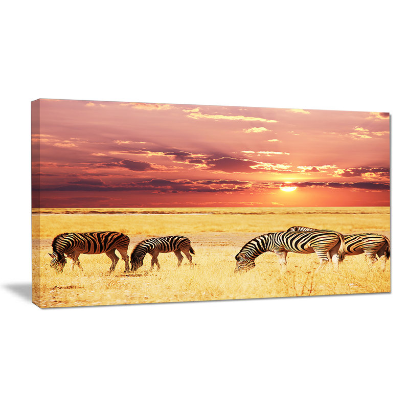 Zebras Grazing Together at Sunset Canvas Landscape Print