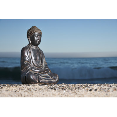 A Japanese Buddha Statue On The Beach by Wesvandinter - Wrapped Canvas Print