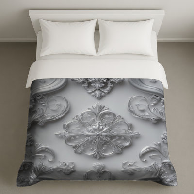 Housses de couette ornées d'argent embellies