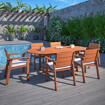 Anautica 6 - Person Wood Patio Dining Set with Oval Table , Cushions Included