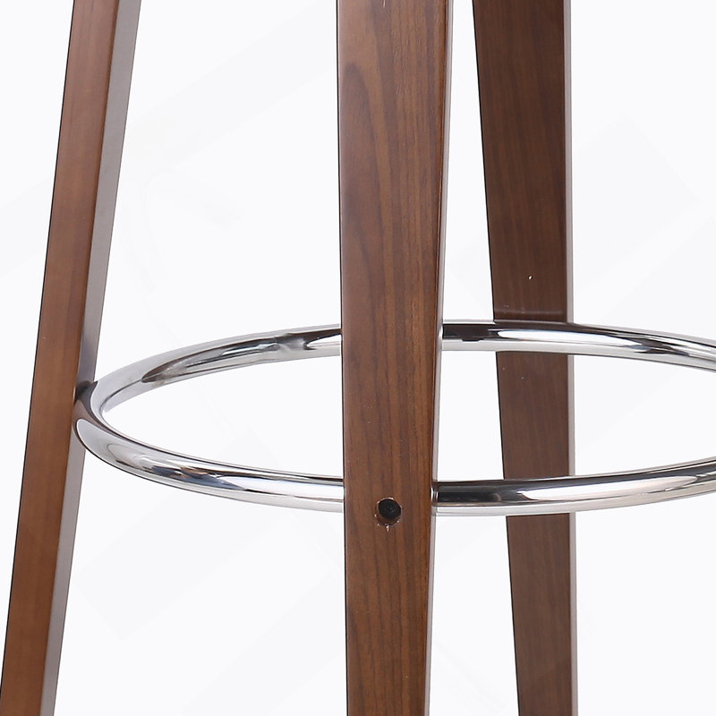 Élégant tabouret de bar rembourré avec une assise confortable et une fabrication durable, pour les cuisines et les bars modernes.