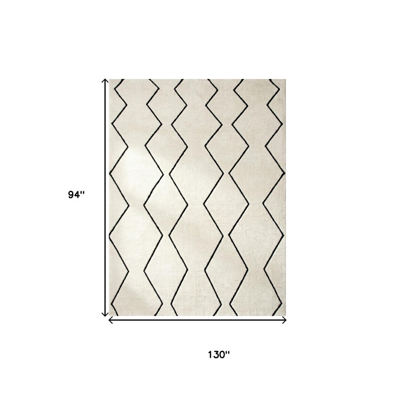 Tapis géométrique beige et noir tissé à la machine 8 pi x 11 pi